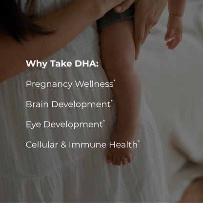 A close-up lifestyle photo of a baby's bare legs and feet resting on a mother's lap, with white text overlaid reading 'Why Take DHA: Pregnancy Wellness, Brain Development, Eye Development, Cellular & Immune Health'.